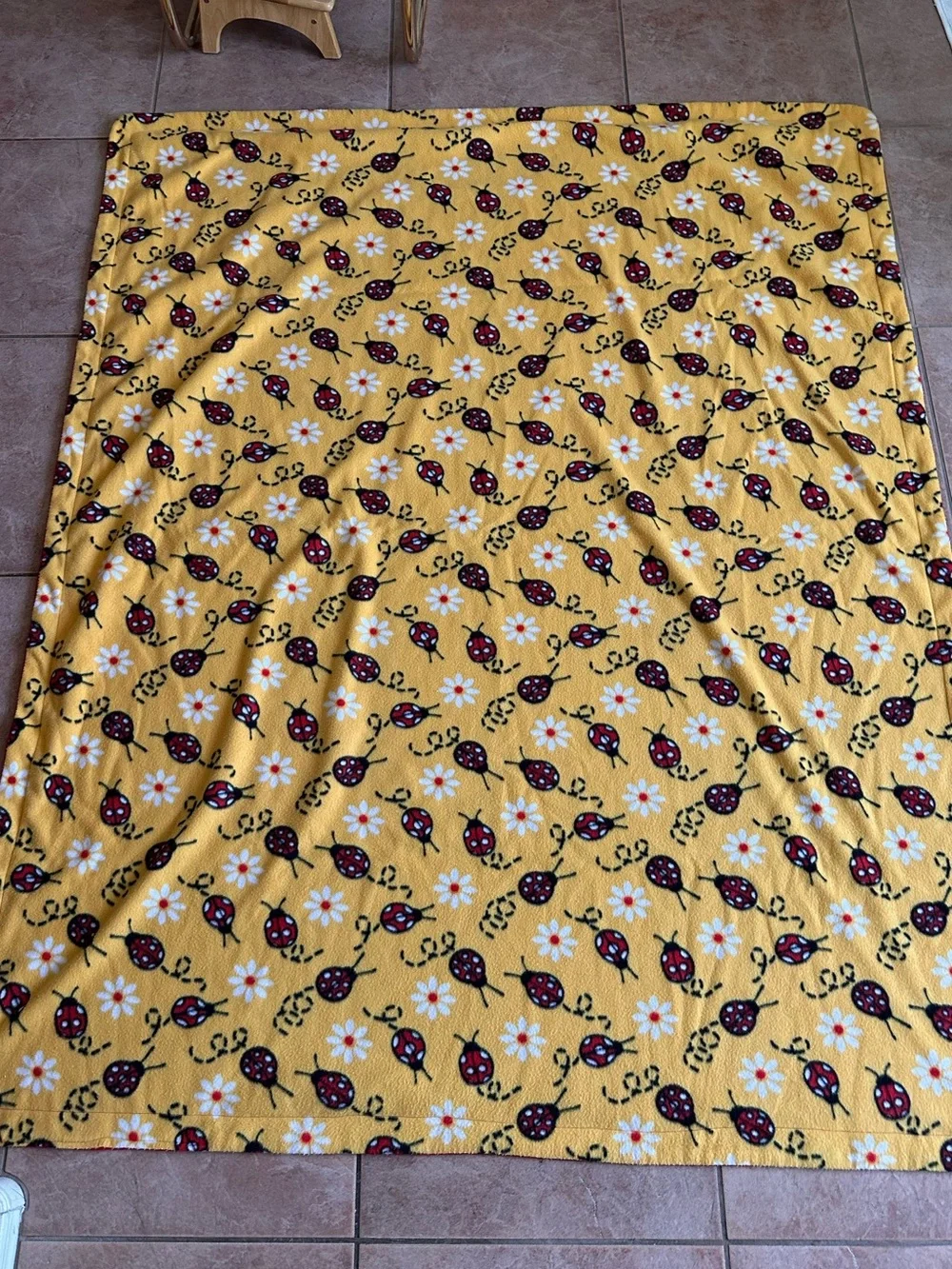 Soft Yellow Blanket with ladybugs and daisies